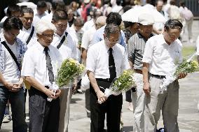 People observe silent prayer at Chidorigafuchi