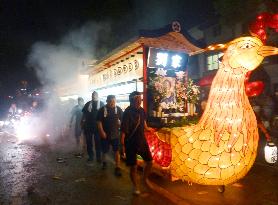 Phoenix boat pulled in Nagasaki Buddhist festival