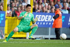 Liege's Kawashima in action against Mouscron-Pruwelz