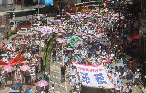 Tens of thousands march in H.K.