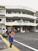 Students leave new building of tsunami-hit school