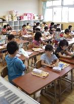 Pupils study in new building of tsunami-hit school