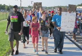 Protesters march against killing of African-American teen