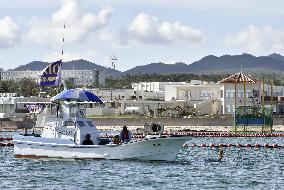 Boat w/Okinawa Defense Bureau flag in Nago