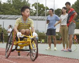 Boy tries sports wheelchair with Paralympics in mind