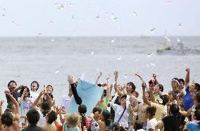 Water balloon fight held on Japan beach