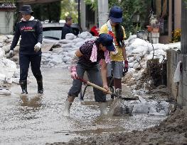 Residents remove mud in landslide-hit area in Hiroshima