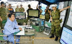 Abe briefed on SDF operations in mudslide-hit Hiroshima