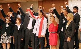 Inoki, wrestlers pose at press meet on event in Pyongyang