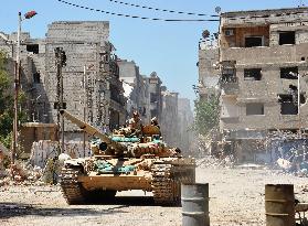 Syrian tank patrols in recaptured Damascus suburb