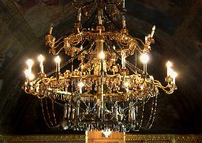 Chandeliers made of weapons parts feature Serbian church