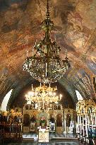 Chandeliers made of weapons parts feature Serbian church