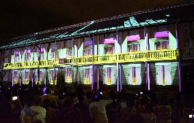 3D images of Tomioka Silk Mill projected on warehouse wall