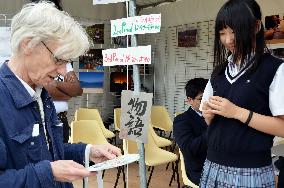 Japanese high schooler at Fukushima festival in Paris