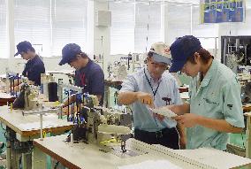 Toyota Boshoku workers learn sewing skills