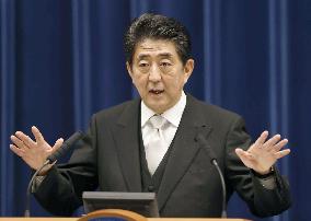 Abe reshuffles Cabinet to tighten grip on power