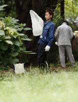 Workers capture mosquitos in Tokyo's Yoyogi Park