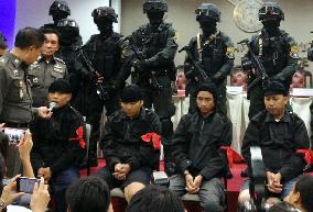 'Men in black' arrested in Thailand