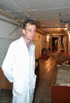 Doctor at Donetsk hospital works at underground shelter