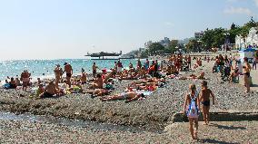 Russian tourists crowd beach in Yalta, Crimea