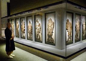 Temple refurbishes exhibit of wooden god reliefs