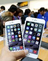 Apple's new iPhone models go on sale in Japan