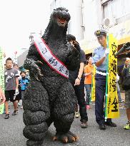 Godzilla appeals for traffic safety
