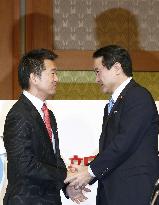 2 opposition parties merge into Japan's 3rd-largest party