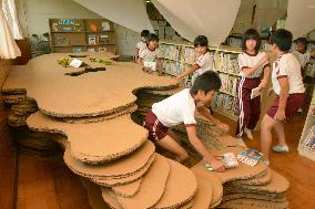 Pupils enjoy refurbished library at Fukushima school
