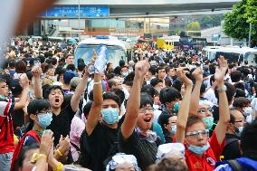H.K. pro-democracy activists block main road