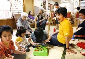 Young, old spend time together at day-care home in Toyama