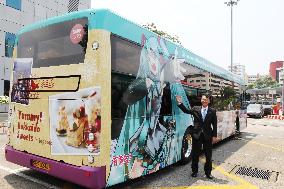 Sapporo deputy mayor shows bus to promote Hokkaido