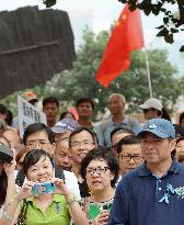 China national flag hoisted at rally against protests in HK