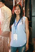Pakistani designer Shahjahan poses at fashion show in Mumbai