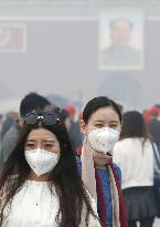 Beijing raises air pollution alert