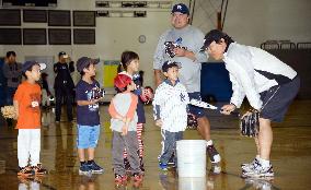 Ex-Yankee Matsui speaks to children during baseball lesson
