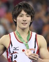 Japan's Kato wins bronze in parallel bars at world championships