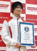 Gymnast Uchimura holds Guinness World Records certificate