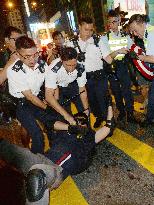 Protester overpowered by police in Hong Kong