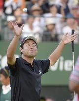 Ikeda reacts after sinking winning putt at Japan Open
