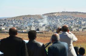 Smoke grows in Kurdish town after airstrikes