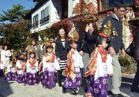 Infants in ancient costumes parade at west Japan temple