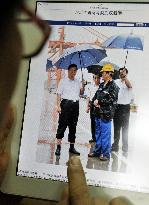 Photo of Xi holding umbrella wins grand prize in China