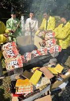 Old purses burned for good fortune at wealth-tied shrine