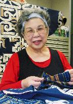 68-year-old woman gets doctoral degree in Ainu attire