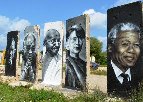 Nobel Peace Prize winners drawn on Berlin Wall pieces