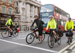 Cyclists await signal change on London street