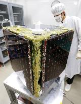 Small satellite shown before launch on H-2A rocket