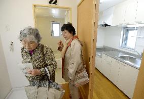 Residents check apartment built for nuke disaster evacuees