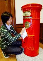 Japan's oldest red pillar post box cleaned